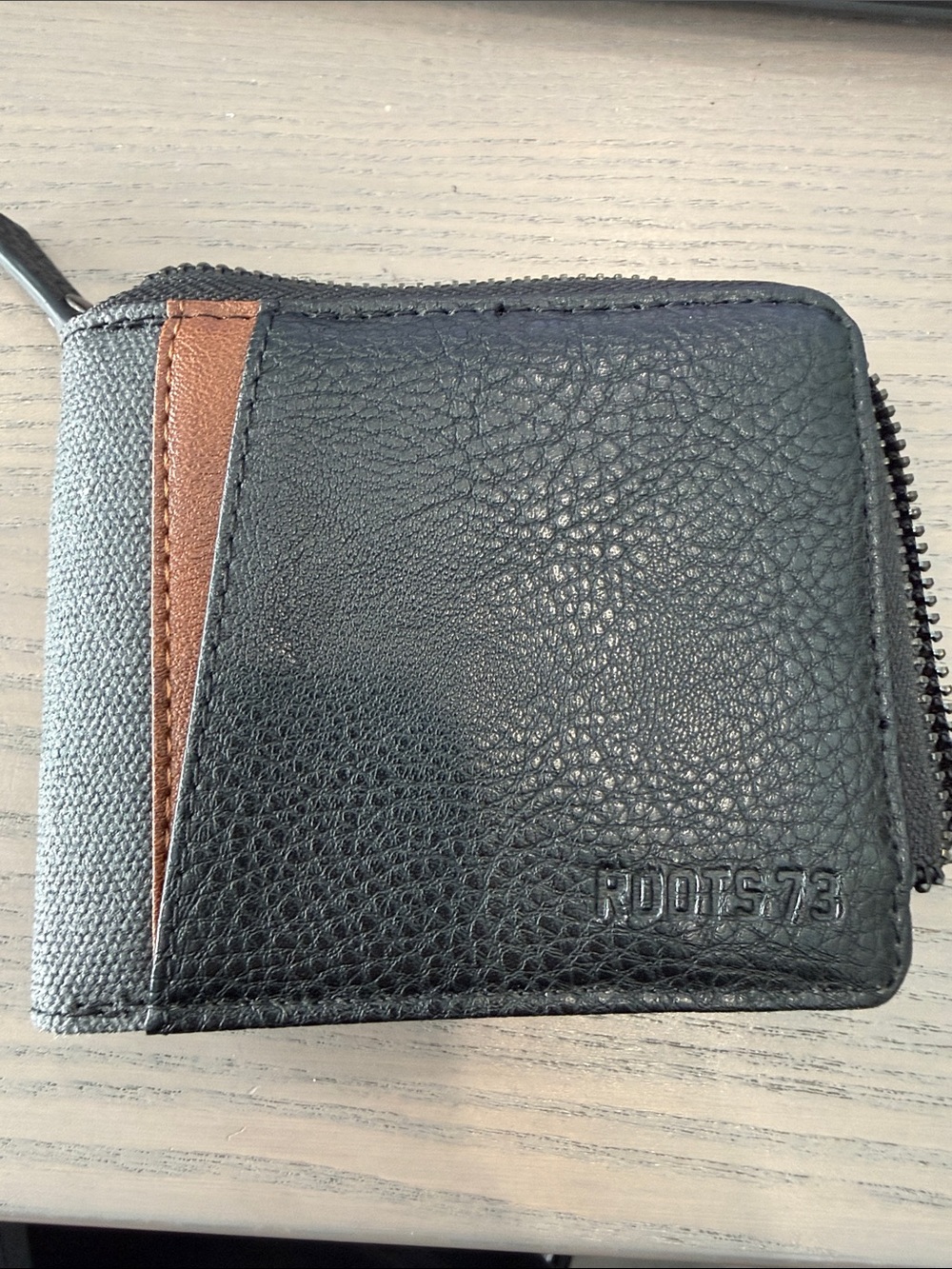 Roots Black Leather Zip Wallet with Brown Accent Strip